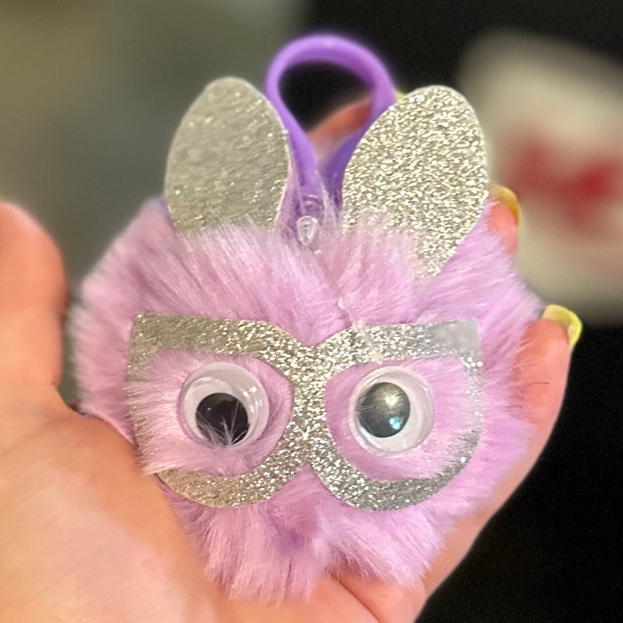 Fuzzy Puff Keychain with googly eyes and glasses